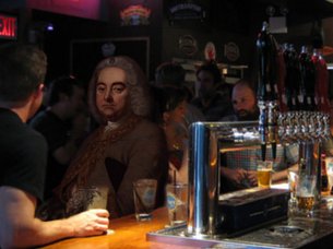 Handel sits at a pub bar