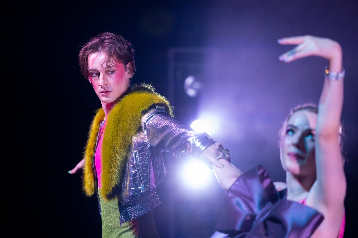 Stage scene with man and woman in intimate expression