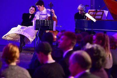 Three artists on stage