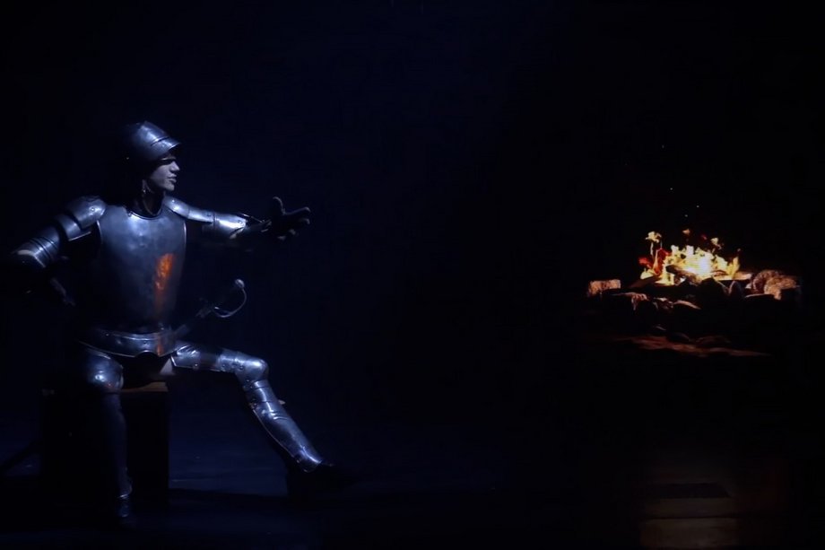Man in knight's armor from a very dark stage