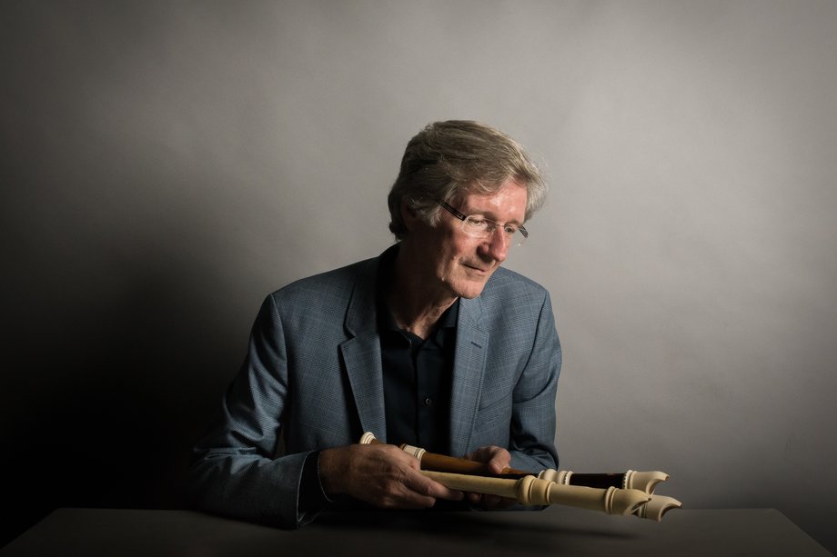 Man with two recorders in his hand